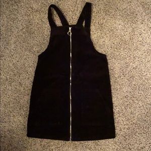 A black corduroy zipper over dress